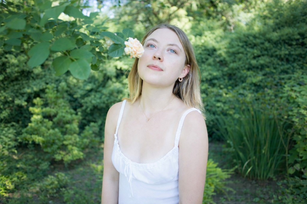 Savannah in a garden, looking toward a pale rose